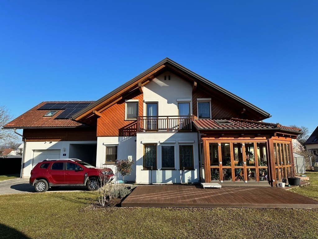 Our house with terrace and winter garden (from west)