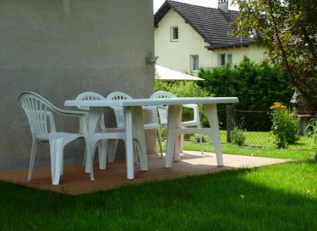 shady terrace behind the house