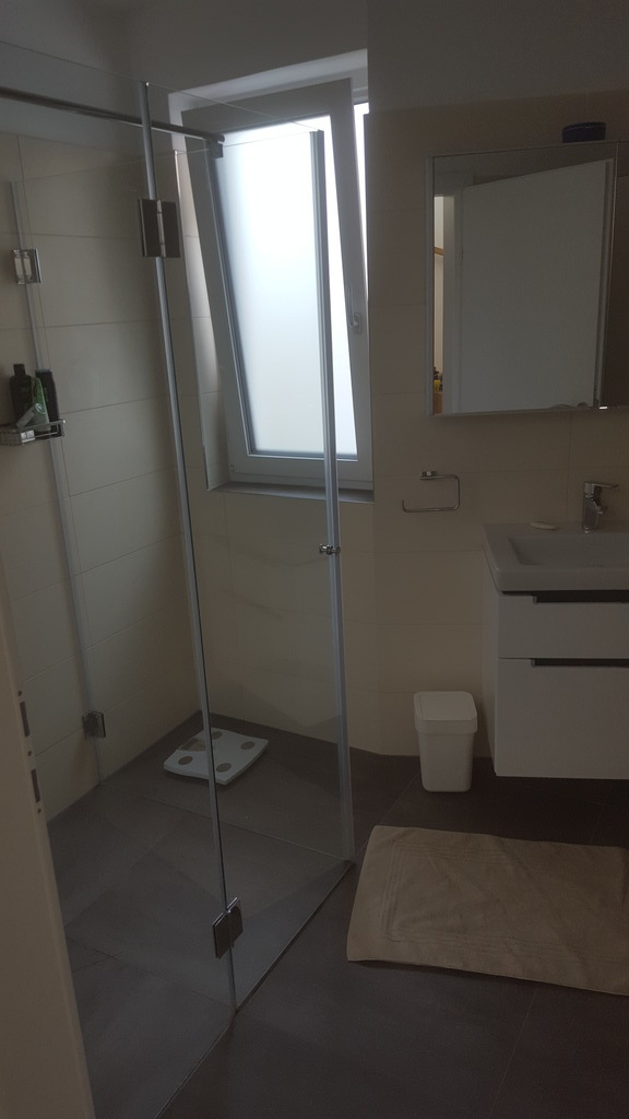 Bathroom with shower and tube