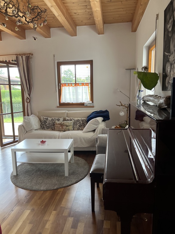 living room with piano