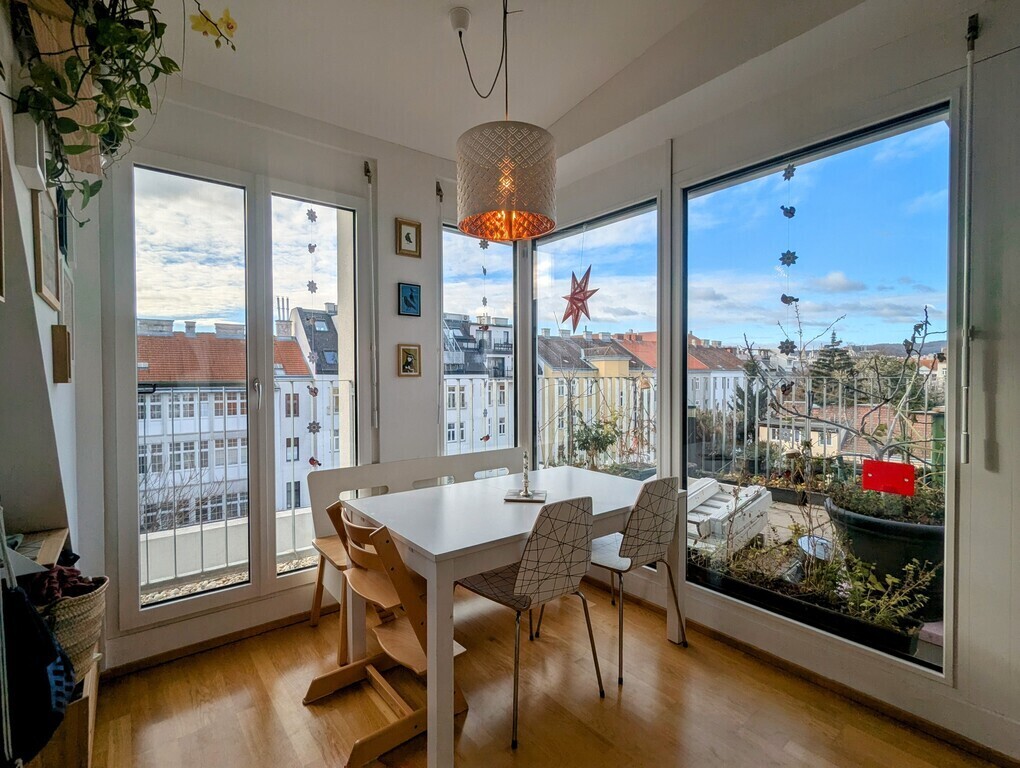Our living dining kitchen is full of sunlight - in summer, shutters on the outside can be closed to keep it cool inside.