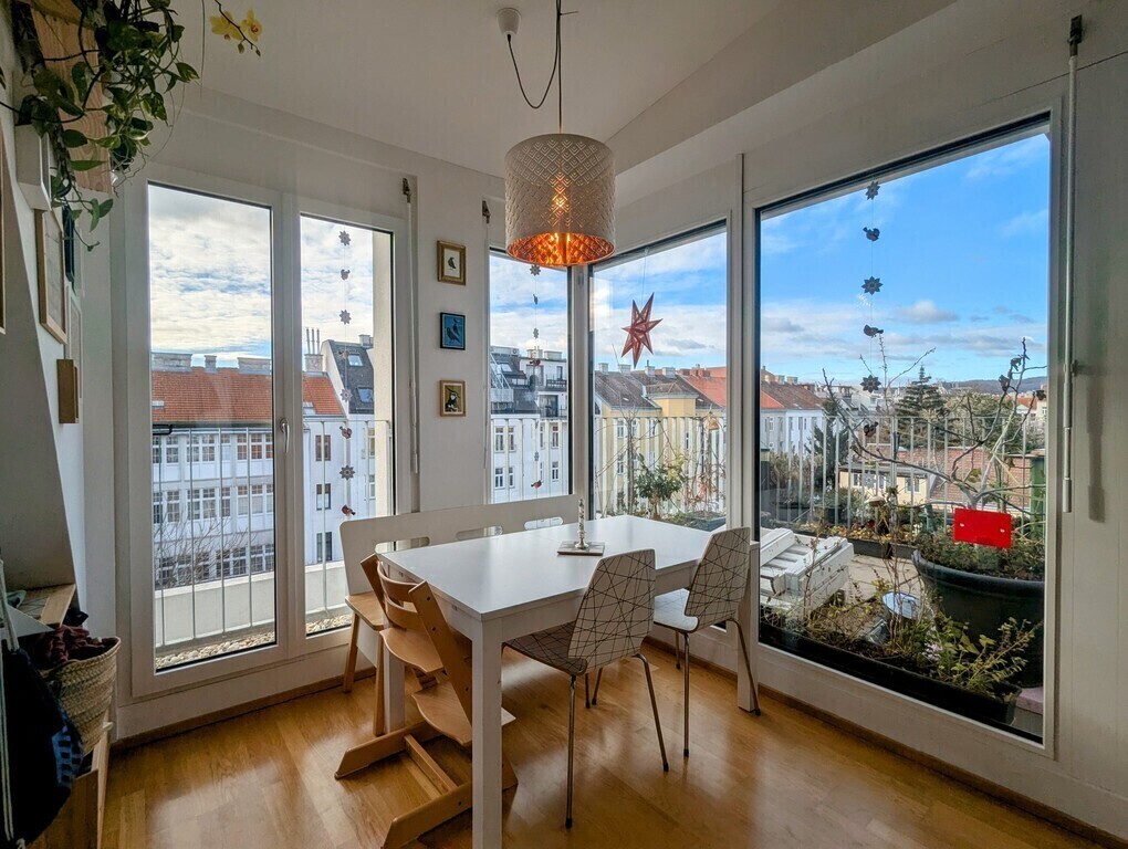 Our living dining kitchen is full of sunlight - in summer, shutters on the outside can be closed to keep it cool inside.
