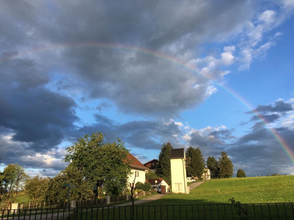 Rainbow next to the house