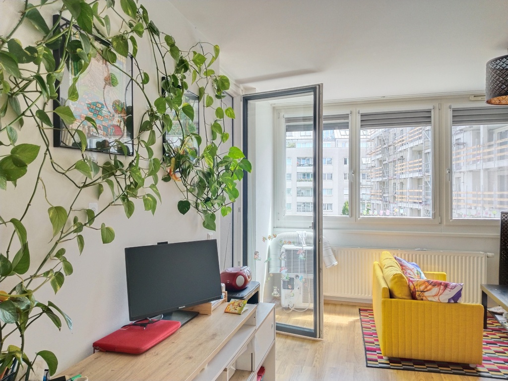 Sunny living ro with a desk