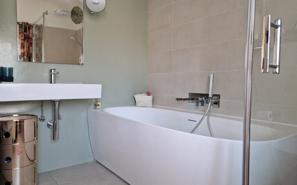 bathroom with shower and toilet