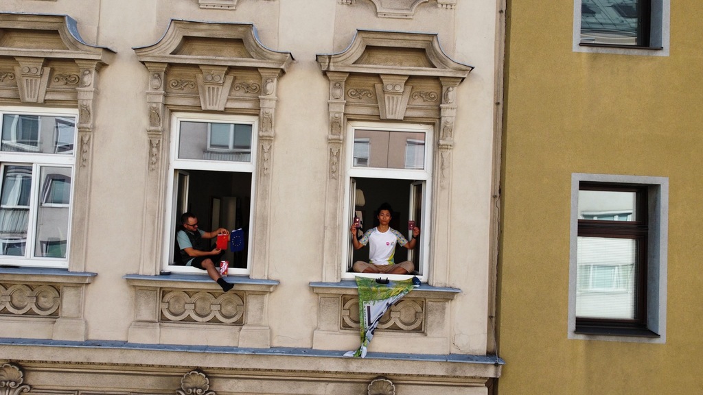 Apartment windows (with me and a couch-surfer in the picture)