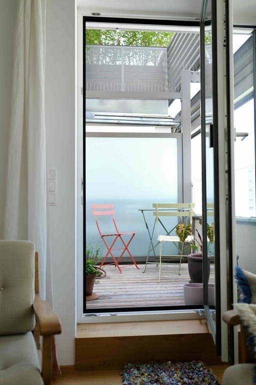 Balcony with table and two chairs