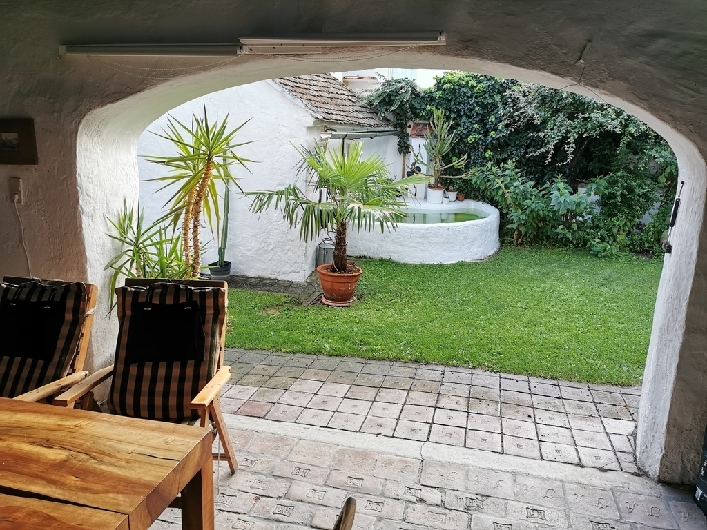 shaded room open to the garden with little water basin usedafter Sauna or on hot days