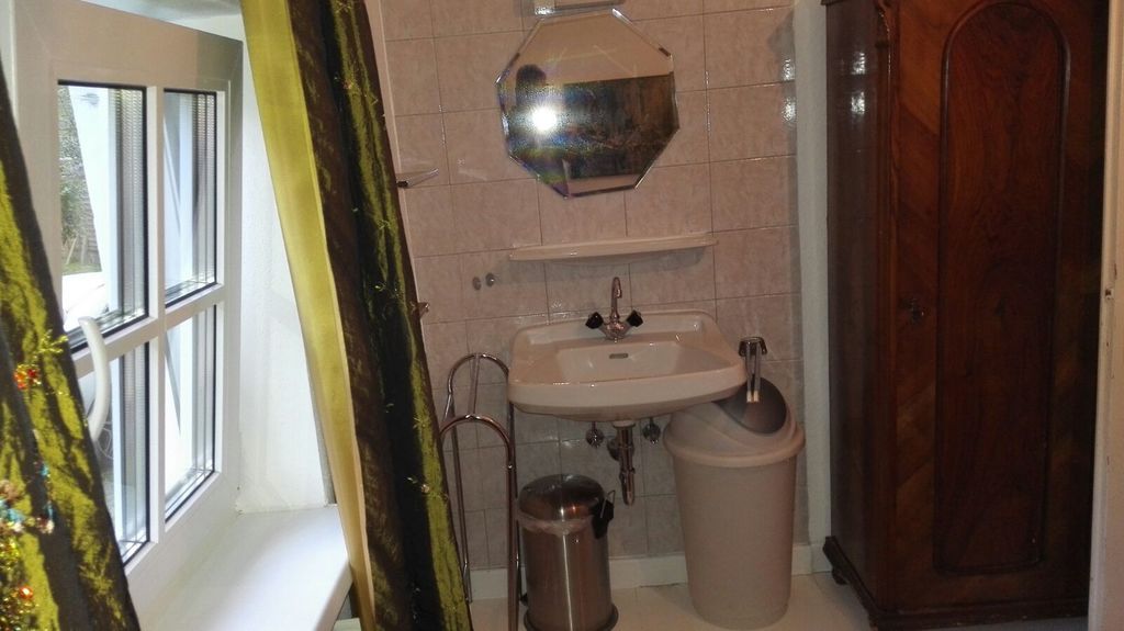 Small garden side bedroom with double bed , and shower