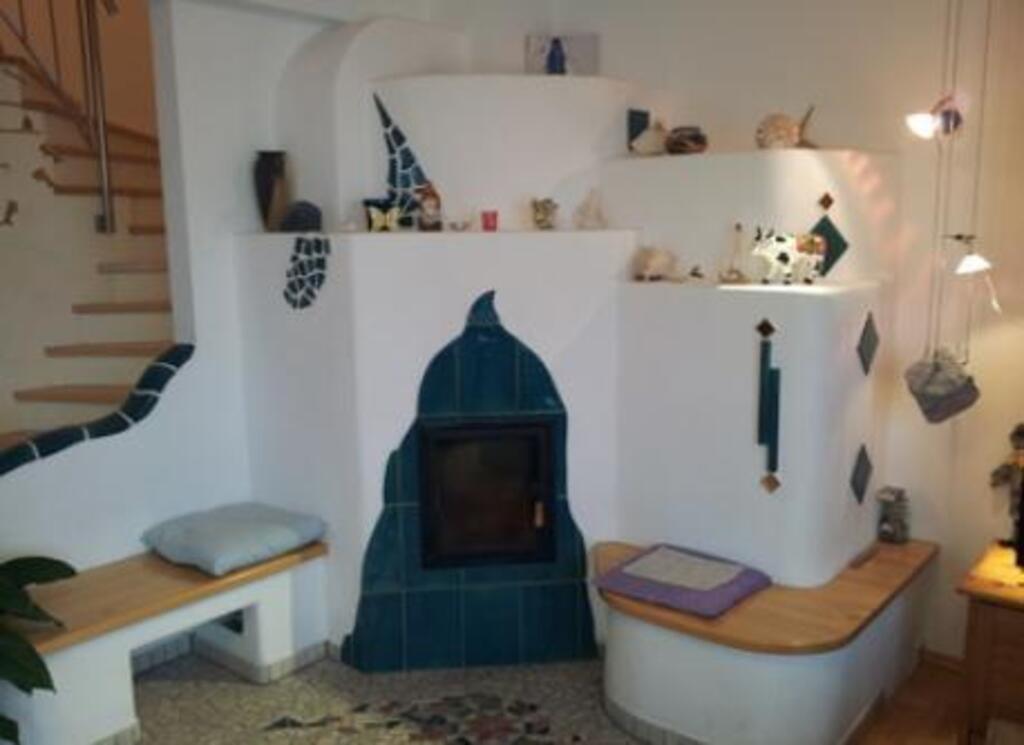 Tiled fireplace and staircase to the first floor