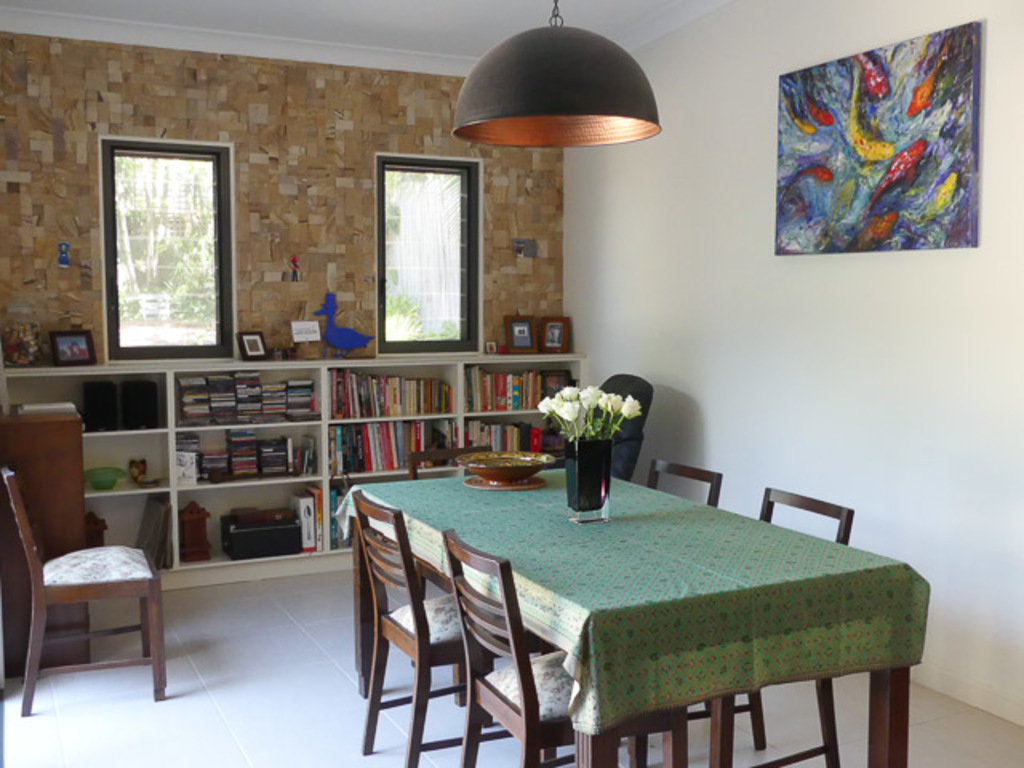 Our new dining room with sandstone wall and plenty of cookbooks