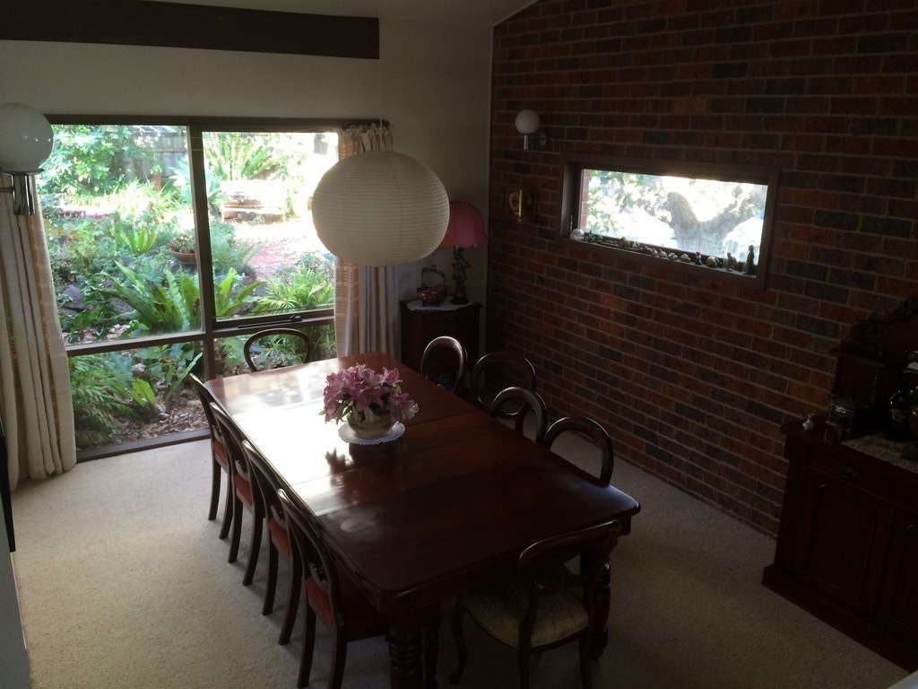 Dining room table seats ten and overlooks its own garden.