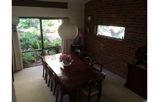 Dining room table seats ten and overlooks its own garden.