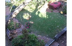Looking down on back garden from upstairs balcony