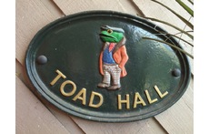 We call our home Toad Hall as it is opposite Frog Hollow