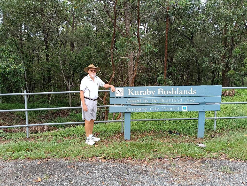 Kerwyn beside our local bushland sign