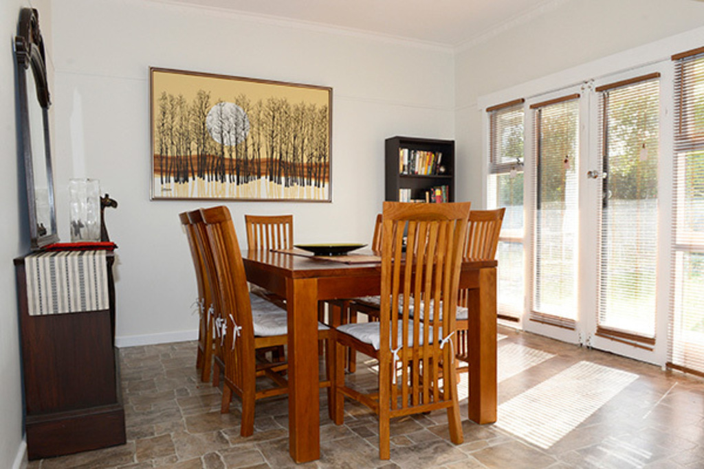 The dining room looks out onto the back garden