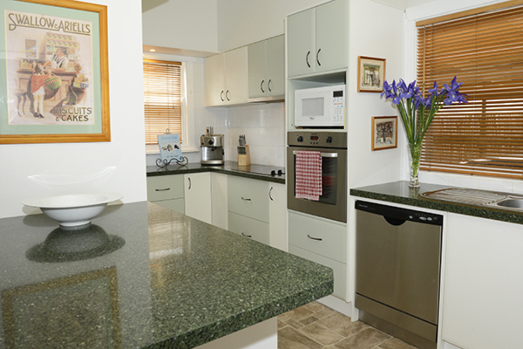 Kitchen with large pantry, oven, microwave, 4x hotplates, dishwasher, full size refrigerator