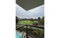 Actual view from the Balcony with Sydney Harbour on the other side of the Oval.