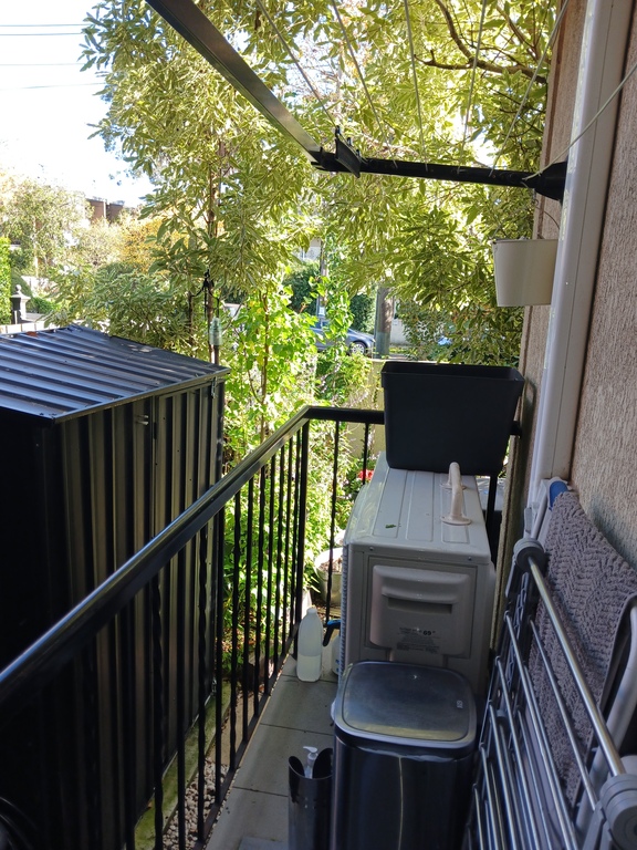 Side balcony , clothes line.