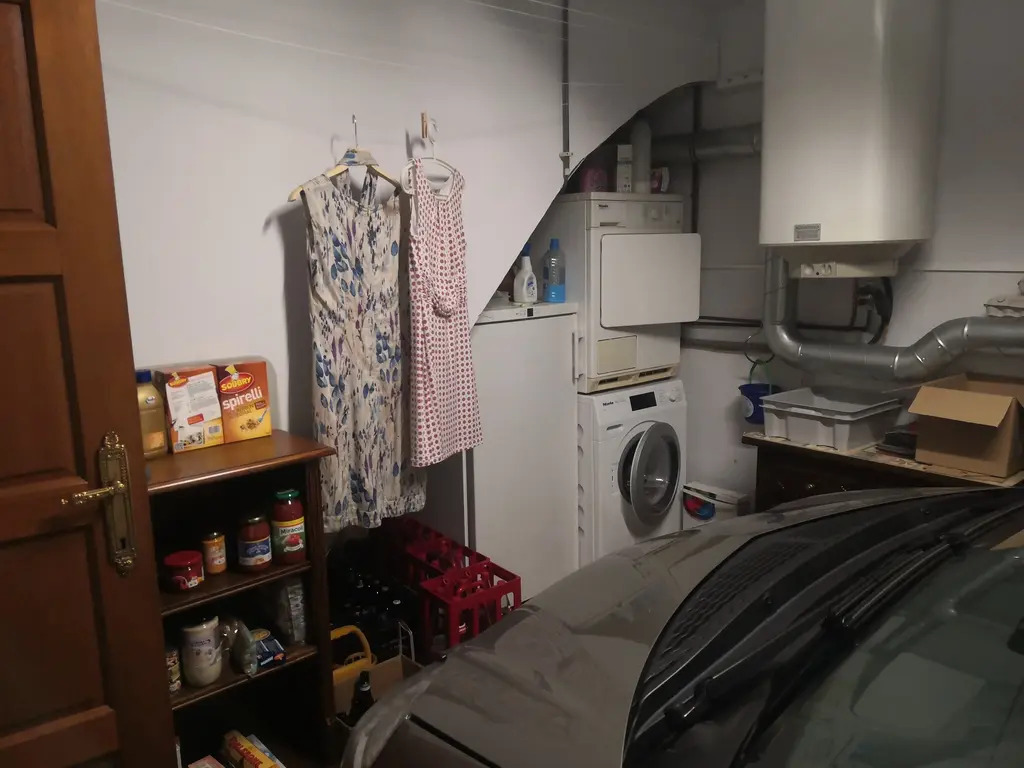 electric boiler, freezer, washing machine and dryer in the garage