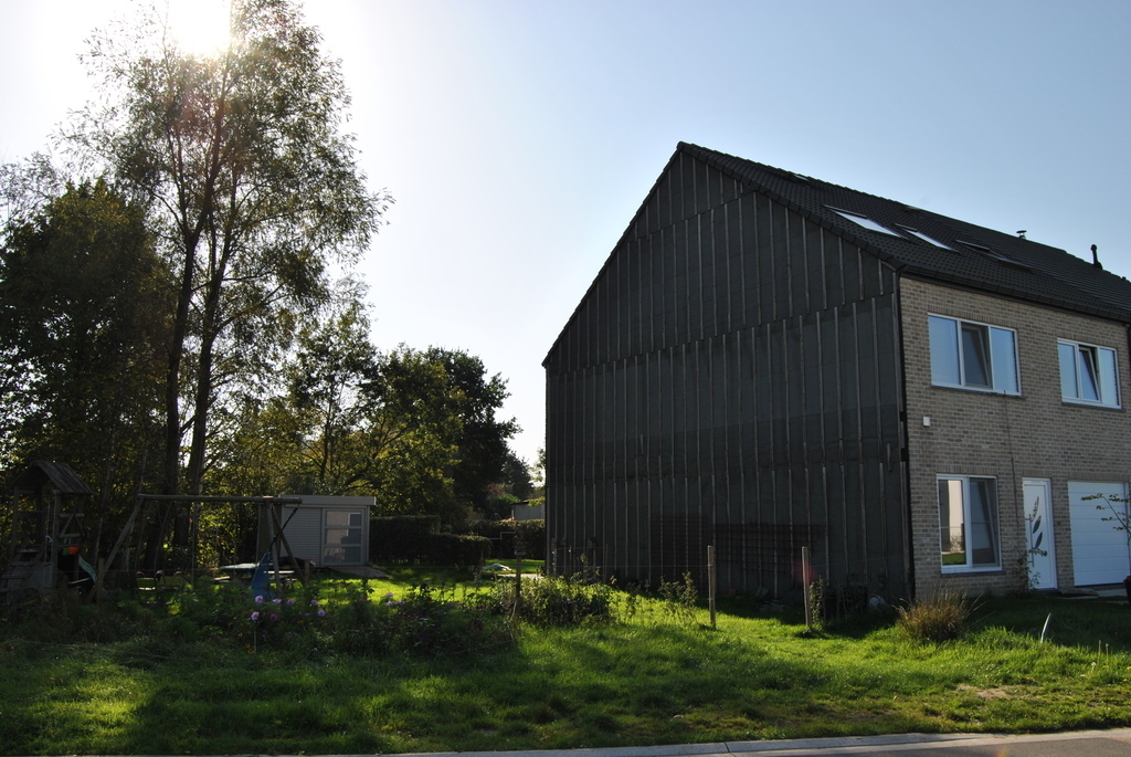 our house and side garden in autumn sunlight