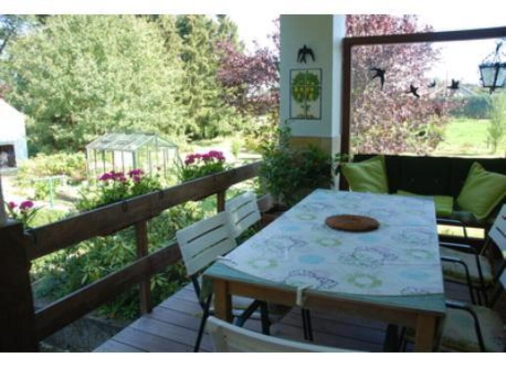 covered sundeck at the back of the house