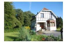 Renovated Anglo-Norman villa next to a wood. 