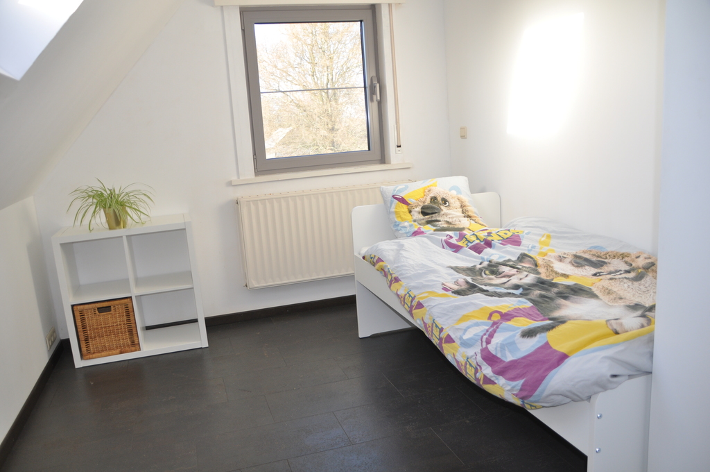 Bedroom 2 with two single beds (one is not yet visible) - all windows with sunscreens and night screens