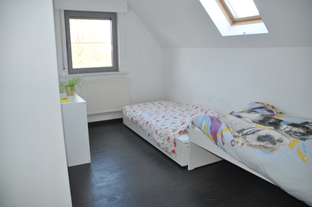 Bedroom 1 with two single beds - all windows with sunscreens and night screens