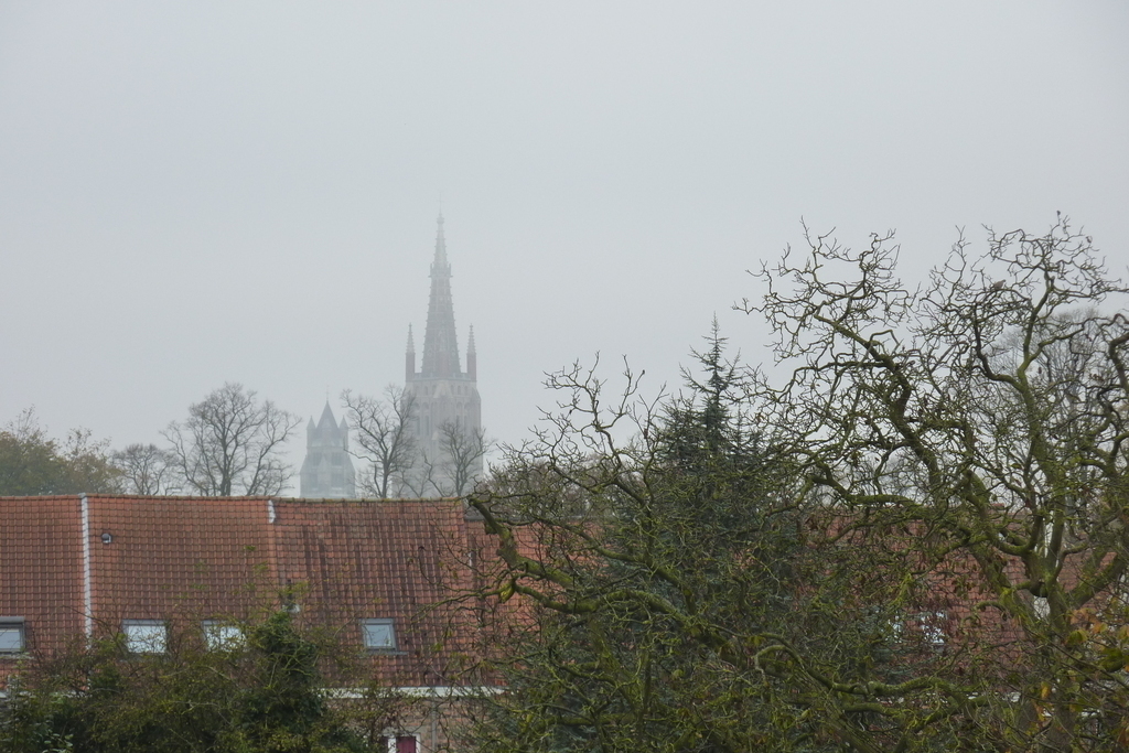 Looking through the window on the second floor you can see the Bruges famous towers.