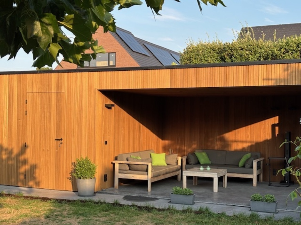Covered backyard lounge space + garden house