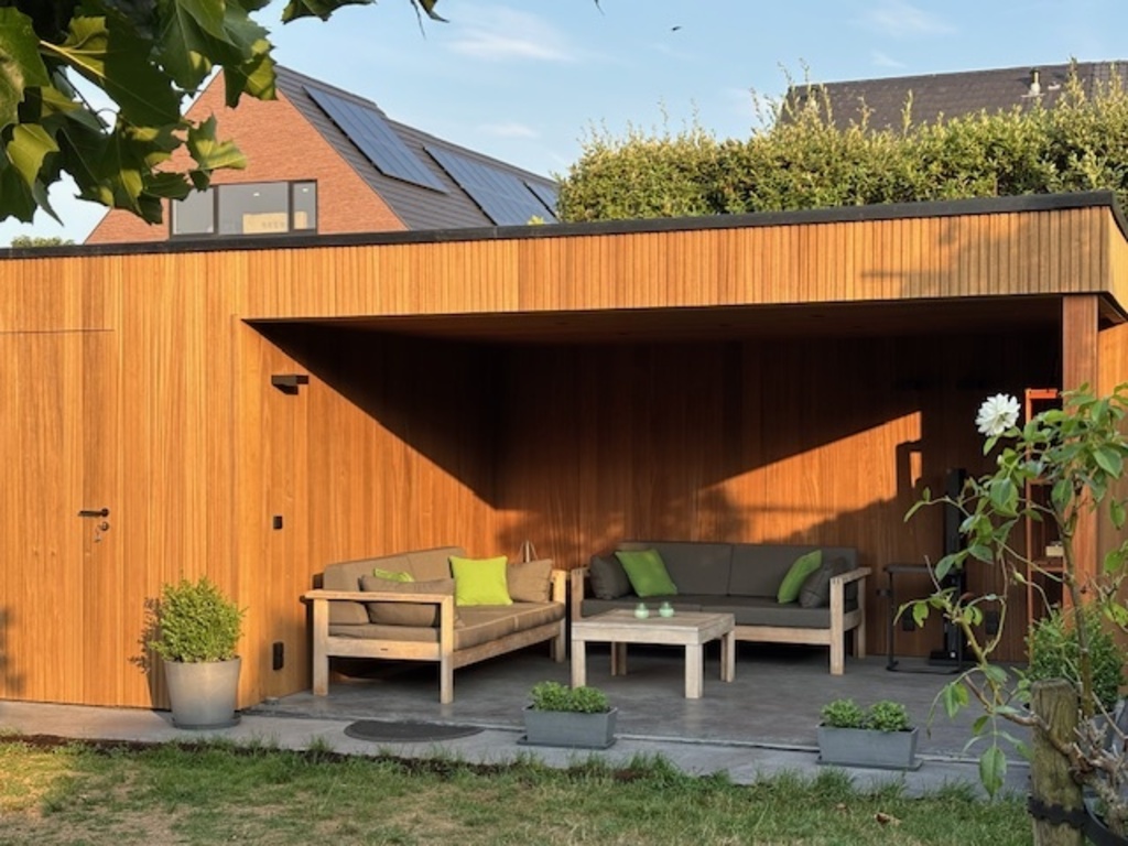 Covered backyard lounge space + garden house