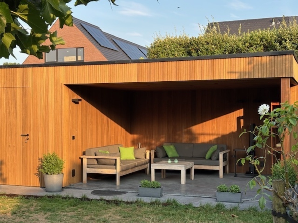 Covered backyard lounge space + garden house