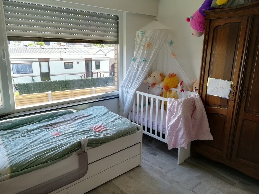 Childrens room with baby bed