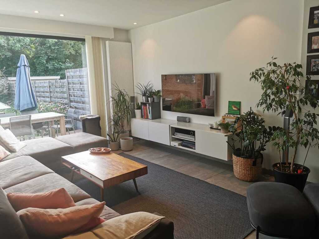 Living room with a large seat. 