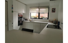 The kitchen is equipped with dishwasher, refrigerator, microwave, oven, induction hob, coffee maker, toaster.