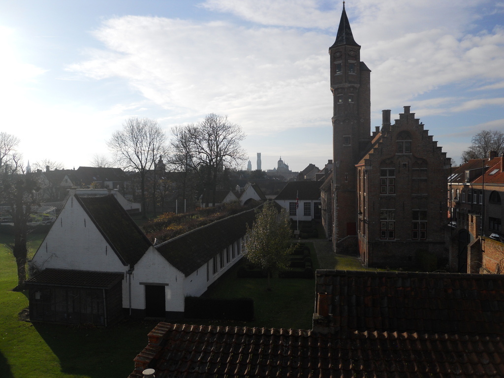 View from the backside bedroom towards the English garden of the archery club with the towers of Bruges on the horizon