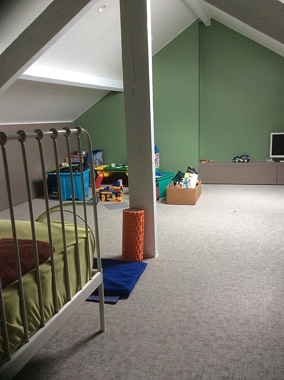 Newly renovated attic room with 1 person bed and toys.