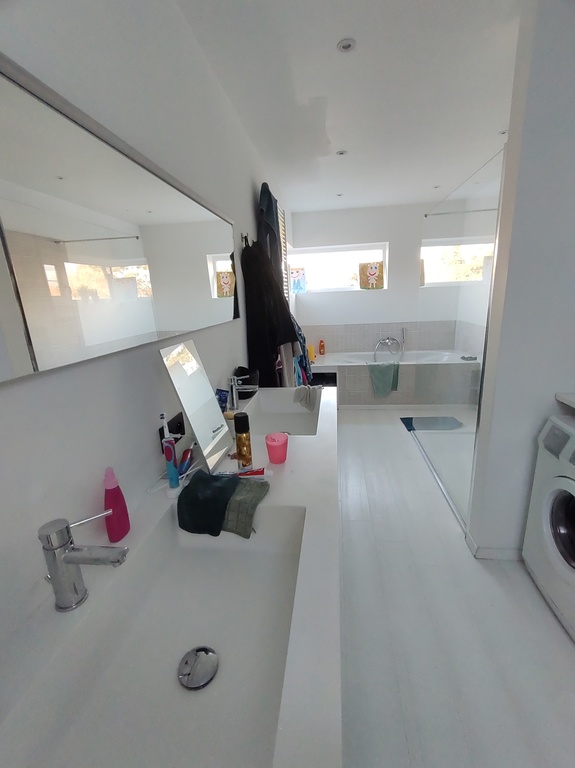 bathroom with bath and shower