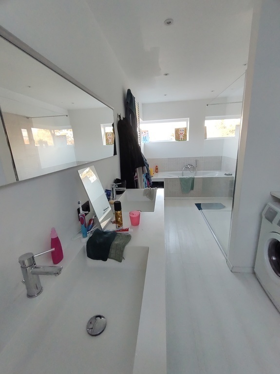 bathroom with bath and shower