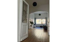 Cozy living room with authentic elements consisting of two parts.