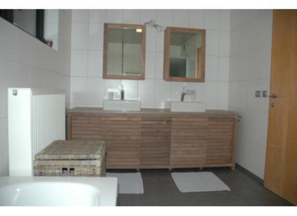bathroom with shower and bath