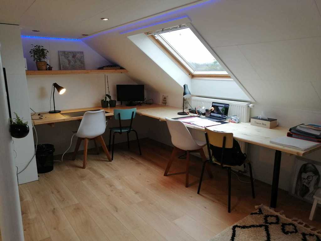 attic with large desk