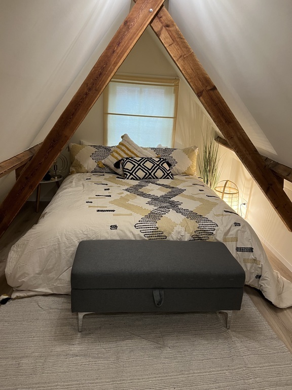 loft bedroom with queen bed