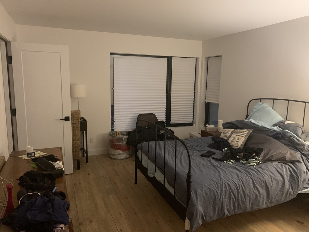 Master bedroom with adjacent bathroom 