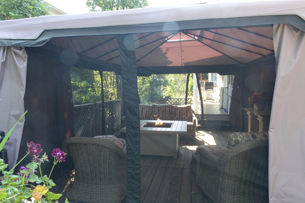 Comfortable, screened canopy with a tabletop propane firepit