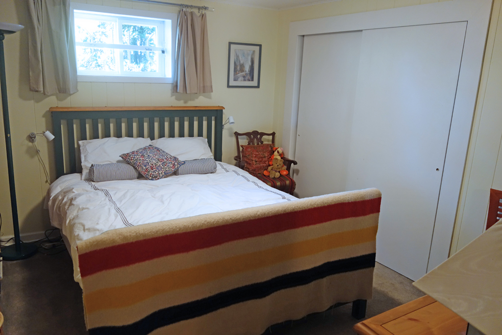 Downstairs bedroom with queen bed