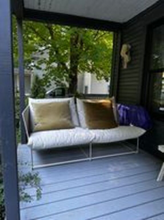 Front porch. A lovely spot to watch the world go by. Across the road is a pond.