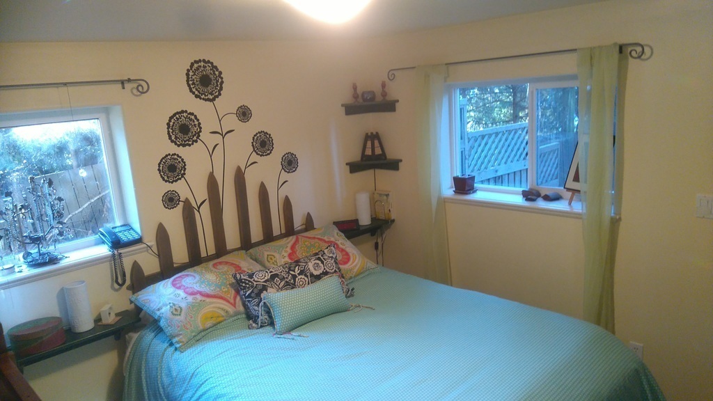 Master bedroom with winter sunlight.  Has access to a private paving stone patio.
